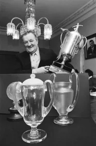 Former Liverpool manager Bob Paisley with a few replicas of the trophies which he won