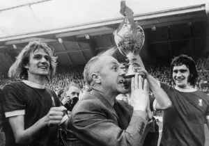 Praying Prints: Liverpool manager Bill Shankly celebrates their League Championshipwin with his players