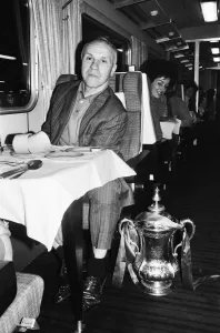 Liverpool manager Bill Shankly with the FA Cup trophy on board the train back to