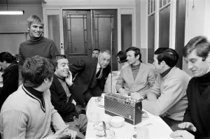 00461 Prints: Liverpool manager Bill Shankly listening to the FA Cup draw with some of his players over