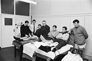 Treatment Prints: Liverpool manager Bill Shankly looks on as three of his players Roger Hunt