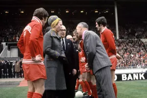 Liverpool manager Bill Shankly shakes hands with Princess Anne at Wembley Stadium before