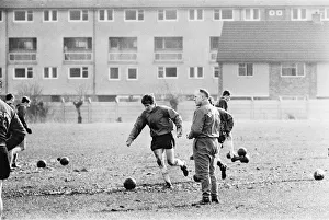Liverpool manager Bill Shankly watches new signing Emlyn Hughes during a training session