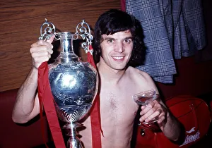 00208 Prints: Liverpool player Peter Cormack celebrates winning the League Championship with the trophy