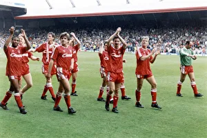 Liverpool players acknowledge their fans and celebrate winning the League Championship