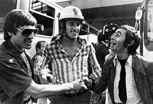 Shirt Prints: Liverpool players Steve Heighway and Ray Clemence share a joke with a fan outside