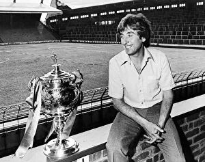 Management Prints: Liverpool Reserve team boss Roy Evans poses beside the Central League Championship trophy
