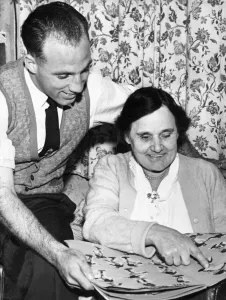 Domestic Life Prints: Liverpool full back Ronnie Moran looking through a scrapbook kept by his mother at home