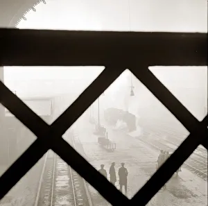 Liverpool Street Station in London The Arched roof is filed with smoke from a steam