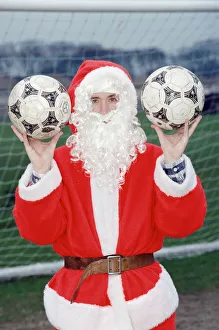 Sack Prints: Liverpool striker Robbie Fowler dressed as Farther Christmas. 19th December 1995