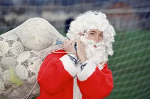 01298 Prints: Liverpool striker Robbie Fowler dressed as Farther Christmas. 19th December 1995