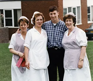 Liverpool striker Robbie Fowler meets up with the dinner ladies at his old school Nugent