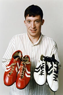 Images Dated 12th March 1996: Liverpool teenage sensation Robbie Fowler with 2 pairs of football boots