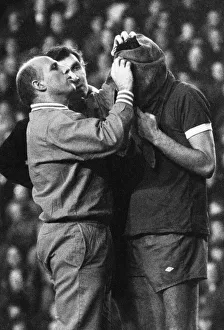 Physio Prints: Liverpool trainer Ronnie Moran attends to John Toshack who has received a nasty cut
