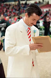 White Suit Prints: Liverpools Ian Rush signing autographs on the pitch at Wembley during the pre match
