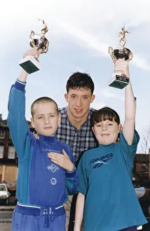 Liverpools Robbie Fowler handing out prizes to youngsters Steven Beck (Prince