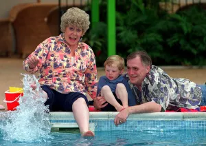 Liz Dawn and William Tarmey as Vera and Jack Duckwort with grandson Tommy Coronation