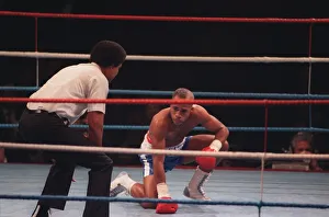 00129 Prints: Lloyd Honeyghan boxer on the canvas being counted Mar 90 by the boxing referee