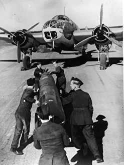 Scotland Prints: Loading a torpedo onto a Beaufort bomber at a Coastal Command station in Scotland