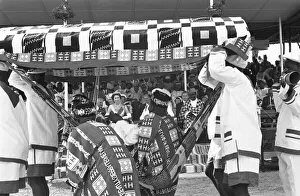National Dress Prints: A local chieftain is carried passed Queen Elizabeth II and Prince Philip