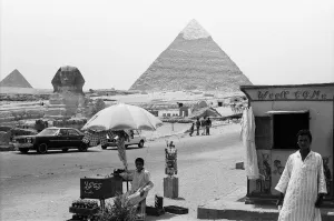 Landscape Feature Prints: Two local egyptians seen here at the Great Pyramid and Sphinx of Giza selling postcards