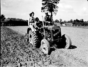 Agriculture Prints: Some local Land Army girls learning to drive a Fordson tractor at the start of the last