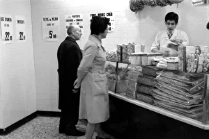 Local people queuing for meat at Boucherie Bernard'the largest butcher