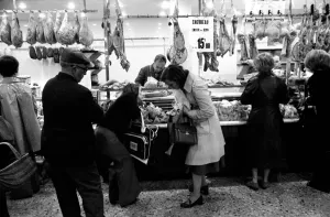 Local people queuing for meat at Boucherie Bernard'the largest butcher