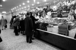 Local people queuing for meat at Boucherie Bernard'the largest butcher
