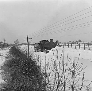 Winter Prints: Locomotive 3218 seen here caught in a snow drift on the Somerset Levels. 1st January 1963