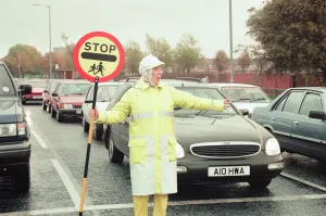 Lollipop lady Janet Taylor on duty at the junction of Trunk Road with Kings Road