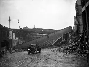 00204 Prints: London Air Raid Bomb Damage WW2 An abandoned truck near the remains of a railway