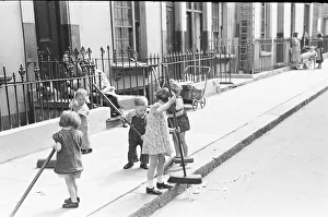 00447 Prints: London Kids, children seen here playing in the street during the spring of 1941 Circa May