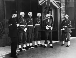 Police Prints: A London sergeant and US Military Police on duty guarding the Royal Cinema in central