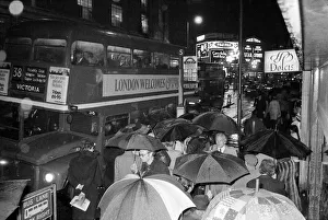 Queues Prints: London travellers are soaked by the rain as the end of the 1976 drought is officially
