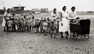 Prams Prints: Londons Blitzed babies are now enjoying the peace and tranquillity of seaside air