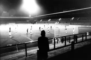 Floodlight Prints: A lone policeman watches from the Upton Park terraces when West Ham played Castilla on a