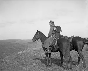 Solitude Prints: A lone Russian soldier stands by a mass grave in Galicia where the bodies of fifty