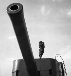 Artillery Prints: A lookout standing on a 9. 2 coastal defence gun on the east coast of Scotland