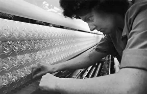 Northern Ireland Prints: Loom operator seen here making fine adjustments to the loom at the Ulster Lace Company