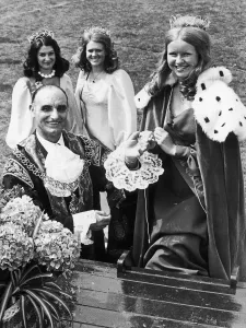 Chains Of Office Prints: Lord Mayor of Coventry John Dennis Berry helps the carnival queen on to her float to head