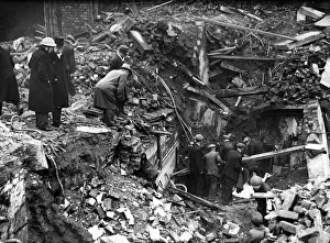 Lord Mayor of Liverpool watching the casualties being brought out of a bombed building in
