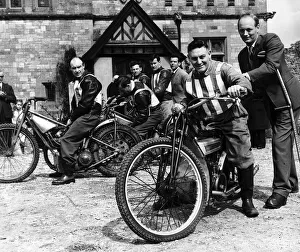 Lord Montague gives veteran speedway rider May 1957 Phil Bishop a shove off - Bishop is