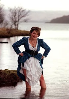 Lorraine Kelly GMTV presenter February 1998 dressed in the tartan dress wading in