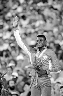 00015 Prints: Los Angeles 1984 Carl Lewis celebrates after winning the 200m at the Olympic Games
