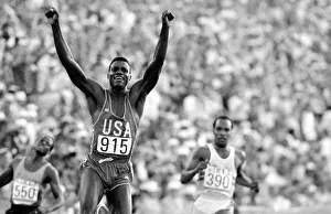 Actions Prints: Los Angeles 1984 Carl Lewis celebrates after winning the Mens 100 metres final