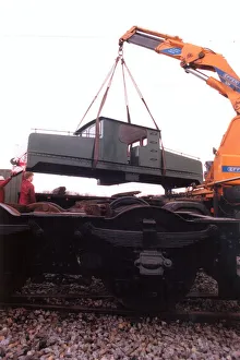A lottery grant facelift begins for the 1909 Siemens locomotive as its is lifted on to a