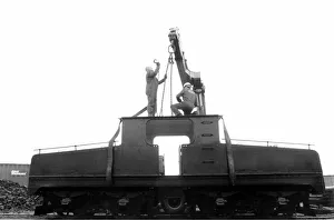 00339 Prints: A lottery grant facelift begins for the 1909 Siemens locomotive as its is lifted on to a