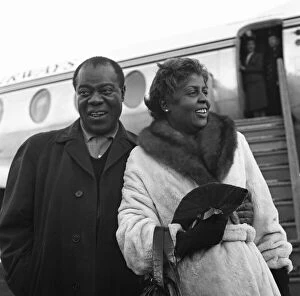 Images Dated 6th April 2020: Louis Armstrong Pictured arriving at a London Airport with wife Lucille