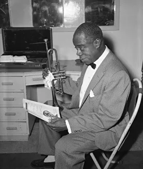 Satchmo Prints: Louis Armstrong seen here in his dressing room before performing in London in May 1956